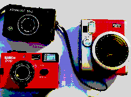 3 cameras, Agfamatic in top left corner, Konica Pop in bottom left corner and Instax on right
